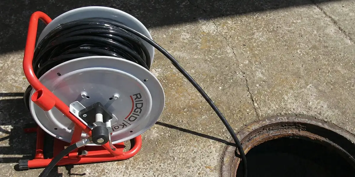 sewer rodding equipment prepared to clear clogged sewer lines in Bellevue, WA